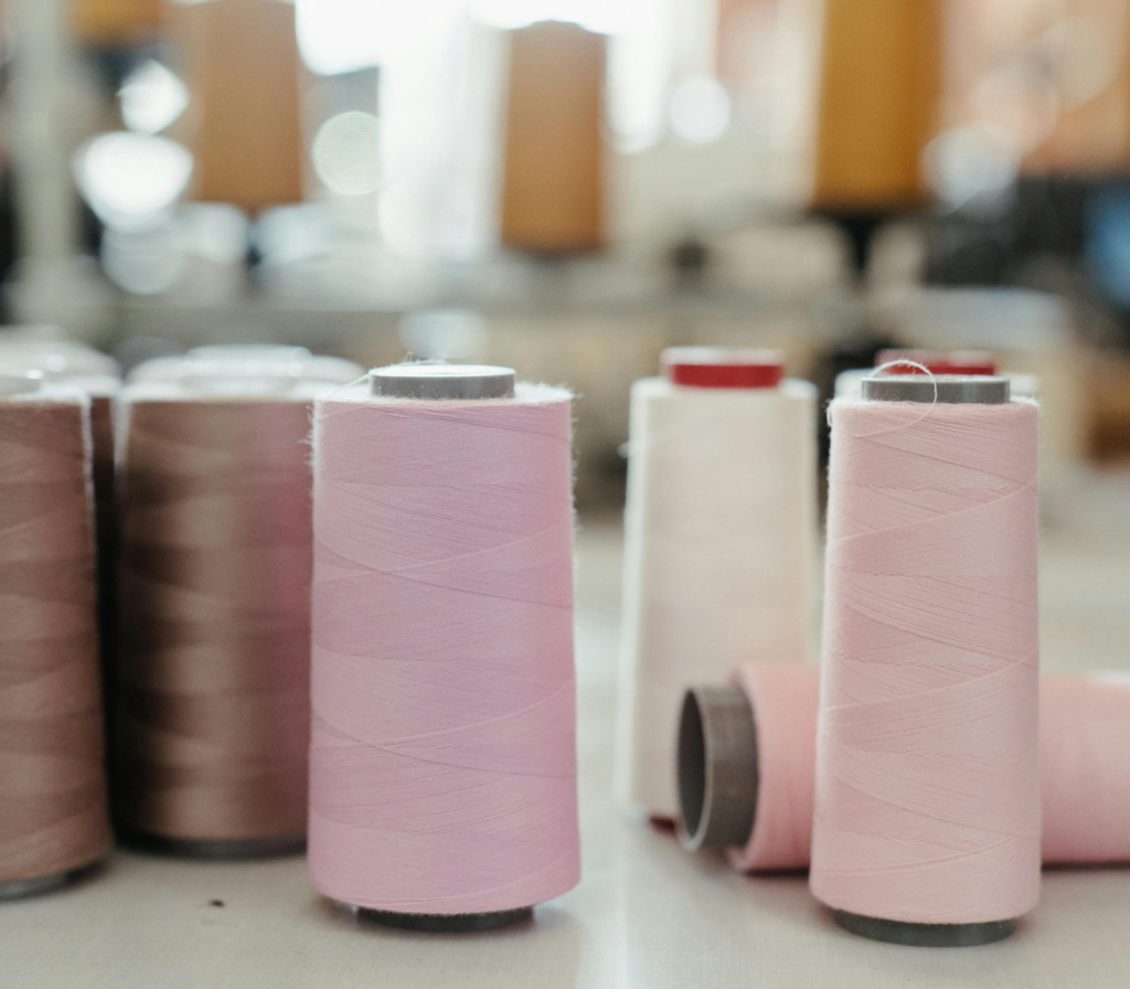 Threads and strings for garment manufacturing in a luxury production studio